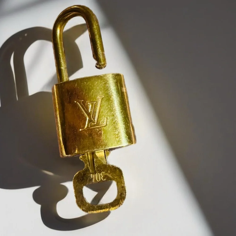 Louis Vuitton GOLD Lock & Key Gold tone Authentic. Number 304 MSRP $300
